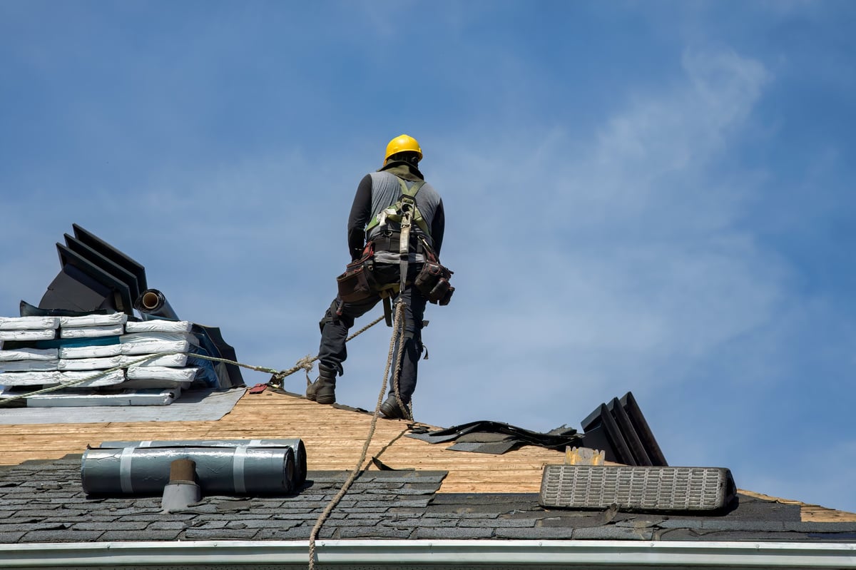 Roofing contractor working on residential roof in Clearwater